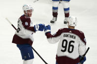 Colorado Avalanche defenseman Cale Makar (8) celebrates his goal with right wing Mikko Rantanen during the first period of an NHL hockey game against the Los Angeles Kings Saturday, May 8, 2021, in Los Angeles. (AP Photo/Marcio Jose Sanchez)