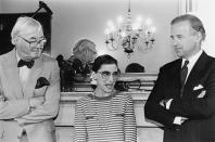 <p>Ginsburg is pictured here with Joe Biden (right) and Senator Daniel Patrick Moynihan (left) the day after Clinton nominated her to <a href="https://www.nytimes.com/1993/03/20/us/the-supreme-court-white-announces-he-ll-step-down-from-high-court.html" rel="nofollow noopener" target="_blank" data-ylk="slk:replace conservative Justice Byron White;elm:context_link;itc:0;sec:content-canvas" class="link ">replace conservative Justice Byron White</a> upon his retirement. </p><p>"In her years on the bench she has genuinely distinguished herself as one of our Nation's best judges," <a href="http://www.presidency.ucsb.edu/ws/index.php?pid=46684" rel="nofollow noopener" target="_blank" data-ylk="slk:Clinton said in his nomination speech;elm:context_link;itc:0;sec:content-canvas" class="link ">Clinton said in his nomination speech</a>. "[She is] progressive in outlook, wise in judgment, balanced and fair in her opinions." </p>