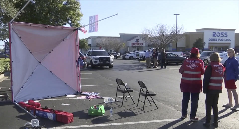 In this Saturday, Feb. 8, 2020, image taken from video a voter registration tent lays on its side after Gregory Timm drove a van through it, in Jacksonville, Fla. The Jacksonville Sheriff's Office said Sunday, Feb. 9, Timm was arrested in the incident. (WJXT News4Jax via AP)