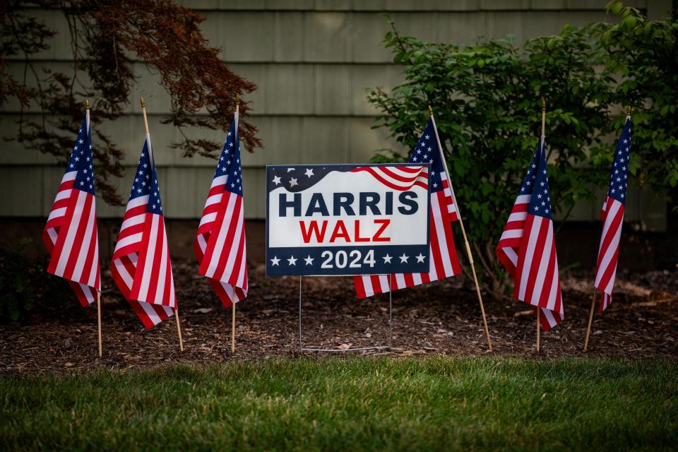 A lawn sign surrounded by American flags in support of U.S. Vice President and Democratic presidential nominee Kamala Harris in Berkley, Michigan, U.S. September 5, 2024.