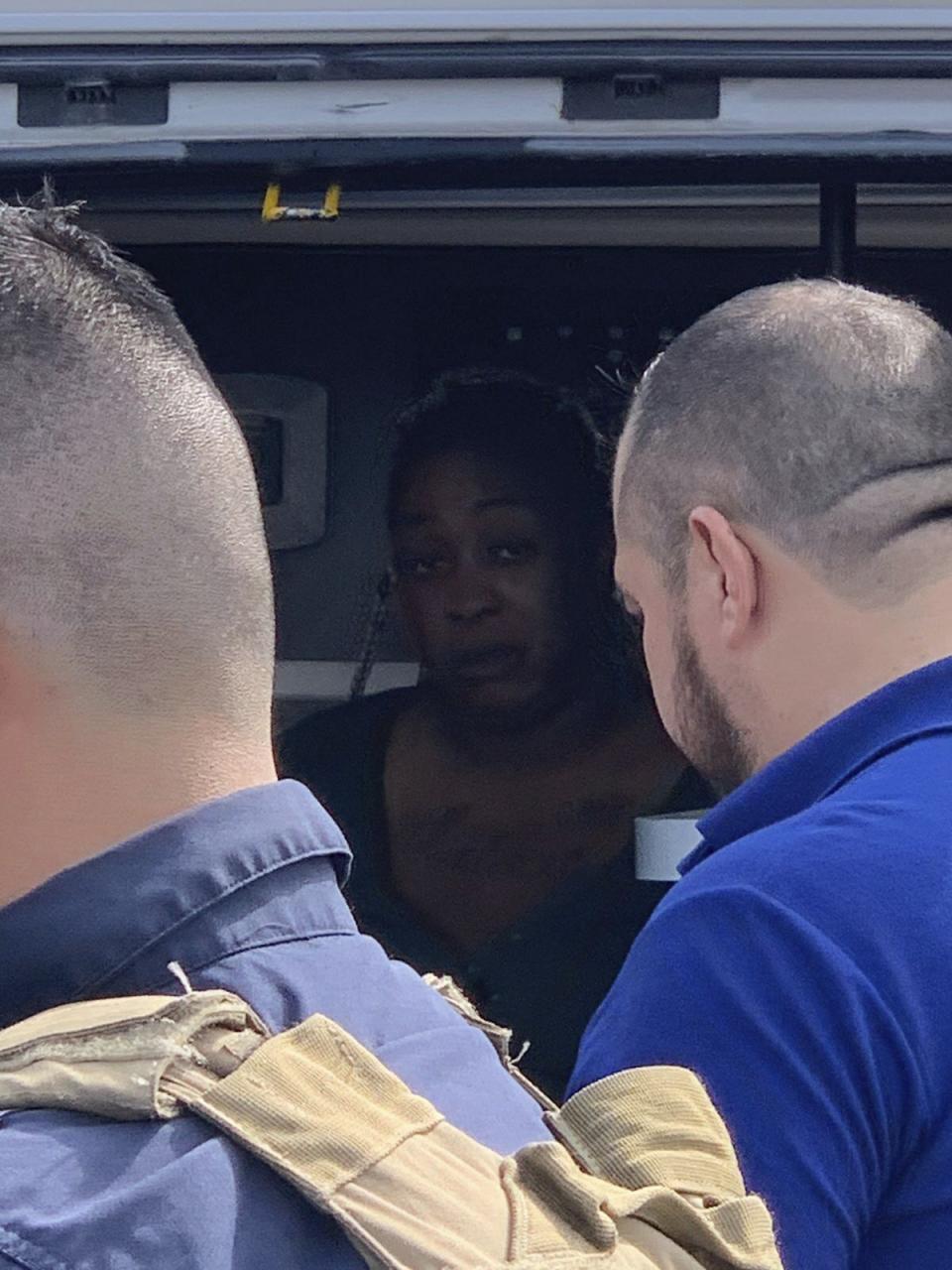 An American woman, abducted in Mexico last week, sits inside an ambulance after she was found alive in Ejido Longoreno, on the outskirts of Matamoros, Mexico, Tuesday, March 7, 2023. Two of four Americans whose abduction in Mexico was captured in a video that showed them caught in a cartel shootout have been found dead, officials said Tuesday. The two surviving Americans, one wounded, were taken to the border near Brownsville, Texas, in a convoy of Mexican ambulances and SUVs. (AP Photo)