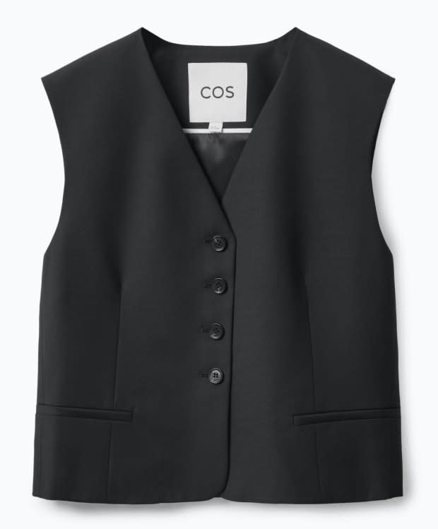 Cos Cropped Single-Breasted Waistcoat, $120, <a href="https://www.cos.com/en_usd/women/womenswear/coats-and-jackets/product.cropped-single-breasted-waistcoat-black.1011657005.html" rel="nofollow noopener" target="_blank" data-ylk="slk:available here;elm:context_link;itc:0;sec:content-canvas" class="link ">available here</a> (sizes 2-14).