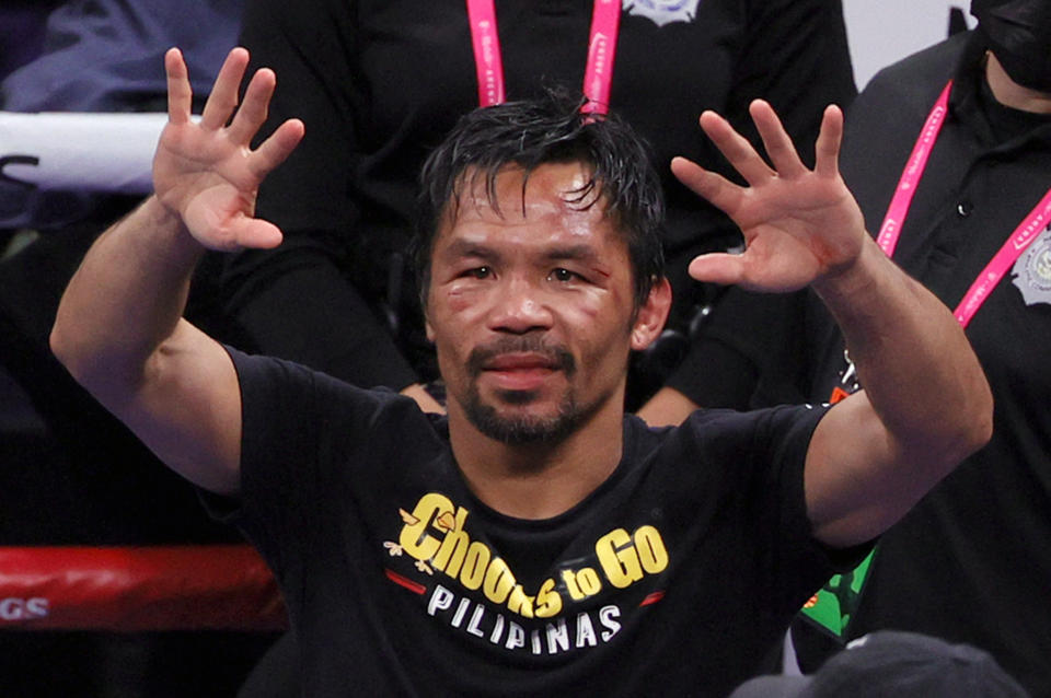 Manny Pacquiao (pictured) gestures to fans after his WBA welterweight title fight against Yordenis Ugas.