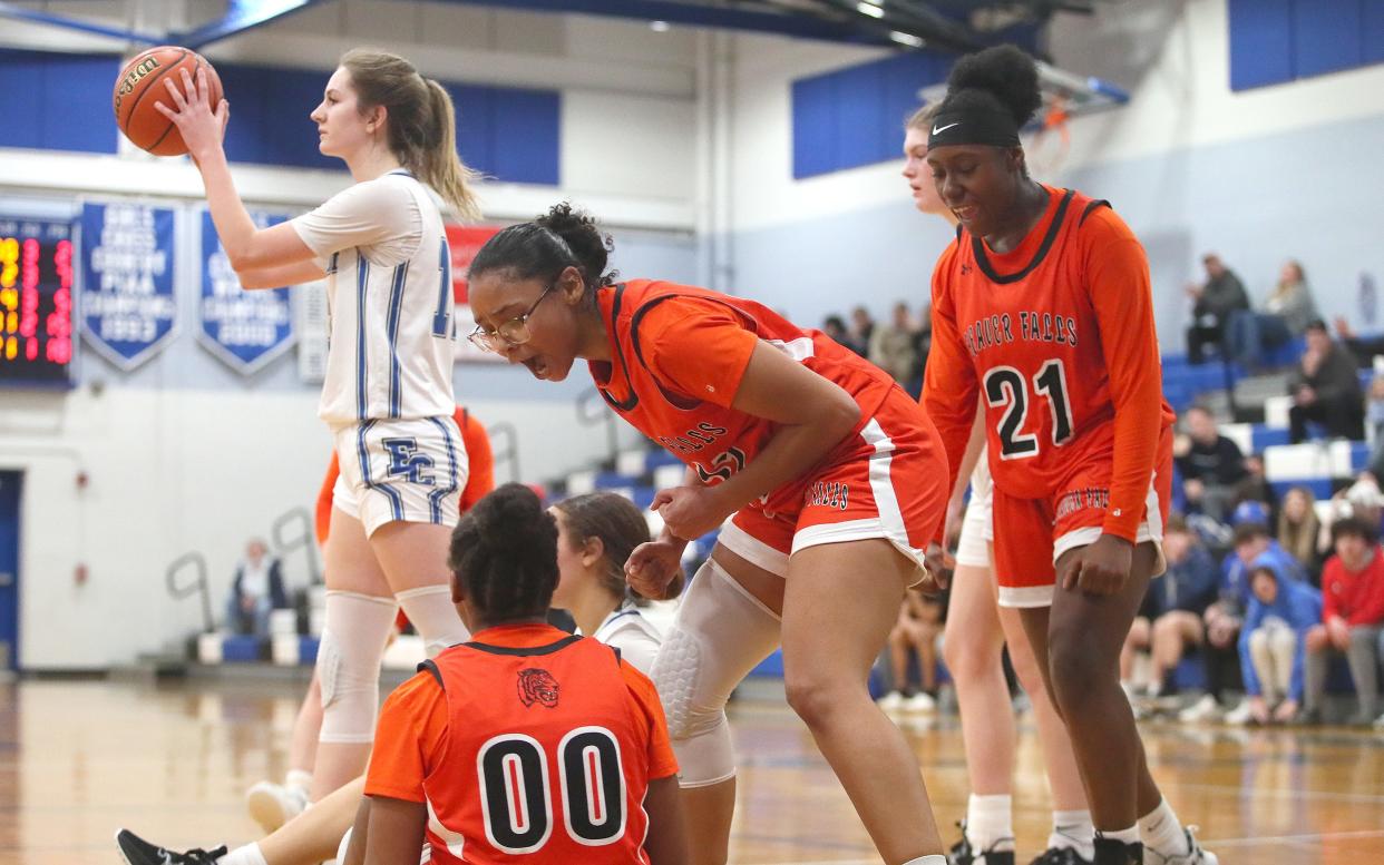 Beaver Falls Carla Brown (11) and Avina Norman (21) react after their teammate Marque Taylor was fouled during the second half against Ellwood City Thursday night at Lincoln High School.