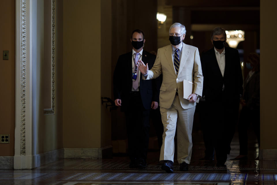 WASHINGTON, D.C., Aug. 10, 2020 -- U.S. Senate Majority Leader Mitch McConnell C walks pass the Ohio Clock Corridor on Capitol Hill in Washington, D.C., the United States, Aug. 10, 2020. Mitch McConnell on Tuesday urged the White House and congressional Democrats to restart negotiations on the next COVID-19 relief bill after talks broke down last week. (Photo by Ting Shen/Xinhua via Getty) (Xinhua/ via Getty Images)