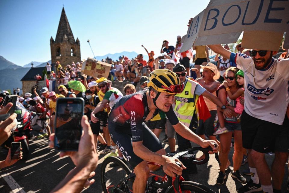 Pidcock rides through the crowds on Alpe d’Huez... (AFP via Getty Images)