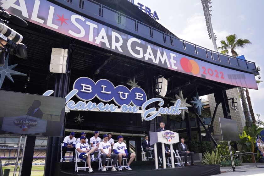 Los Angele mayor Eric Garcetti, right, speaks as members of the Los Angeles Dodgers look on during an event to officially launch the countdown to MLB All-Star Week Tuesday, May 3, 2022, at Dodger Stadium in Los Angeles. The All-Star Game is scheduled to be played on July 19. (AP Photo/Mark J. Terrill)