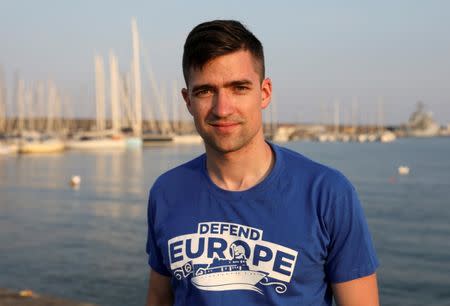 Martin Sellner, spokesman for Identitarian movement in Austria, poses in the harbour of Catania, Italy, July 19, 2017. REUTERS/Antonio Parrinello