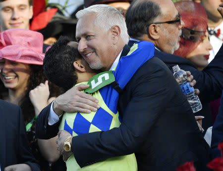 FILE PHOTO - May 6, 2017; Louisville , KY, USA; Horse jockey John Velazquez gets a hug from trainer Todd Pletcher after riding Always Dreaming to victory in the 2017 Kentucky Derby at Churchill Downs. Mandatory Credit: Jamie Rhodes-USA TODAY Sports