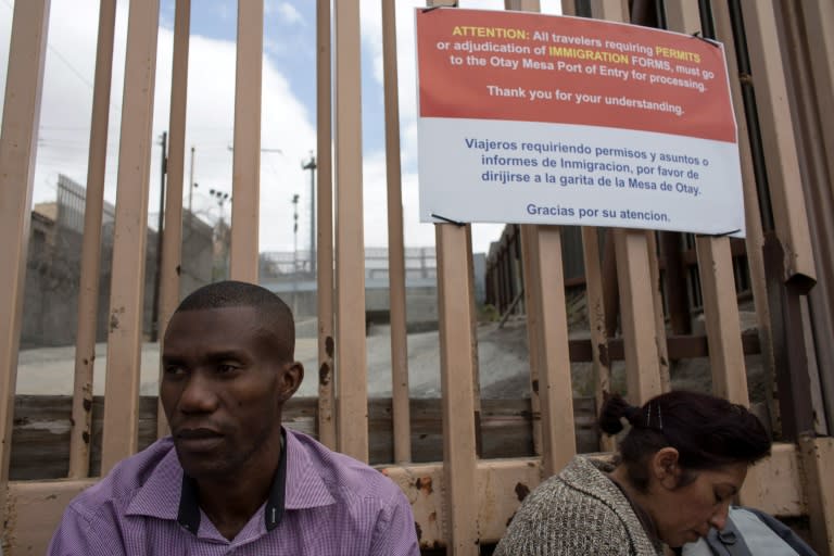 A migrant from Haiti waits at the San Isidro Port of Entry on May 26, 2016 in Tijuana, Mexico