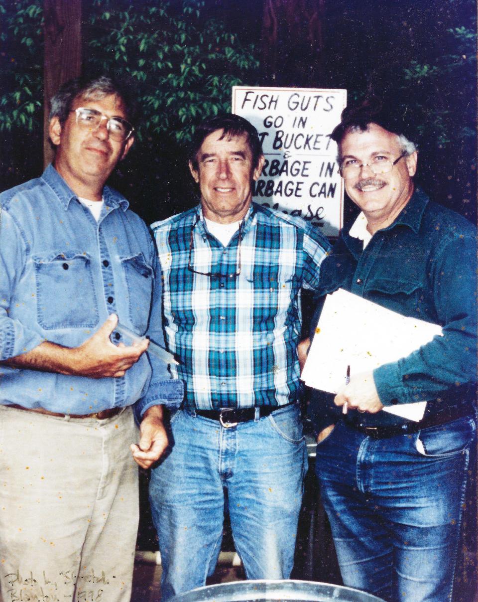 Circa mid-1990s, "Heartland" host Bill Landry, UT aquatic biologist Dr. David Etnier and News Sentinel columnist Sam Venable (from left) officiated a fishing tournament sponsored by Knoxville's Second District Dental Society. Landry is holding one of Etnier's syringes used for preserving selected species for the university's fish collection.