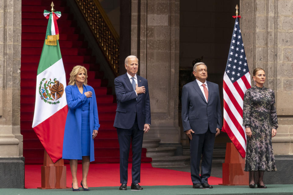 From left, first lady Jill Biden, President Joe Biden, Mexican President Andres Manuel Lopez Obrador, and his wife Beatriz Gutiérrez Müller stand for their national anthems during an arrival ceremony at the National Palace in Mexico City, Mexico, Monday, Jan. 9, 2023. (AP Photo/Andrew Harnik)
