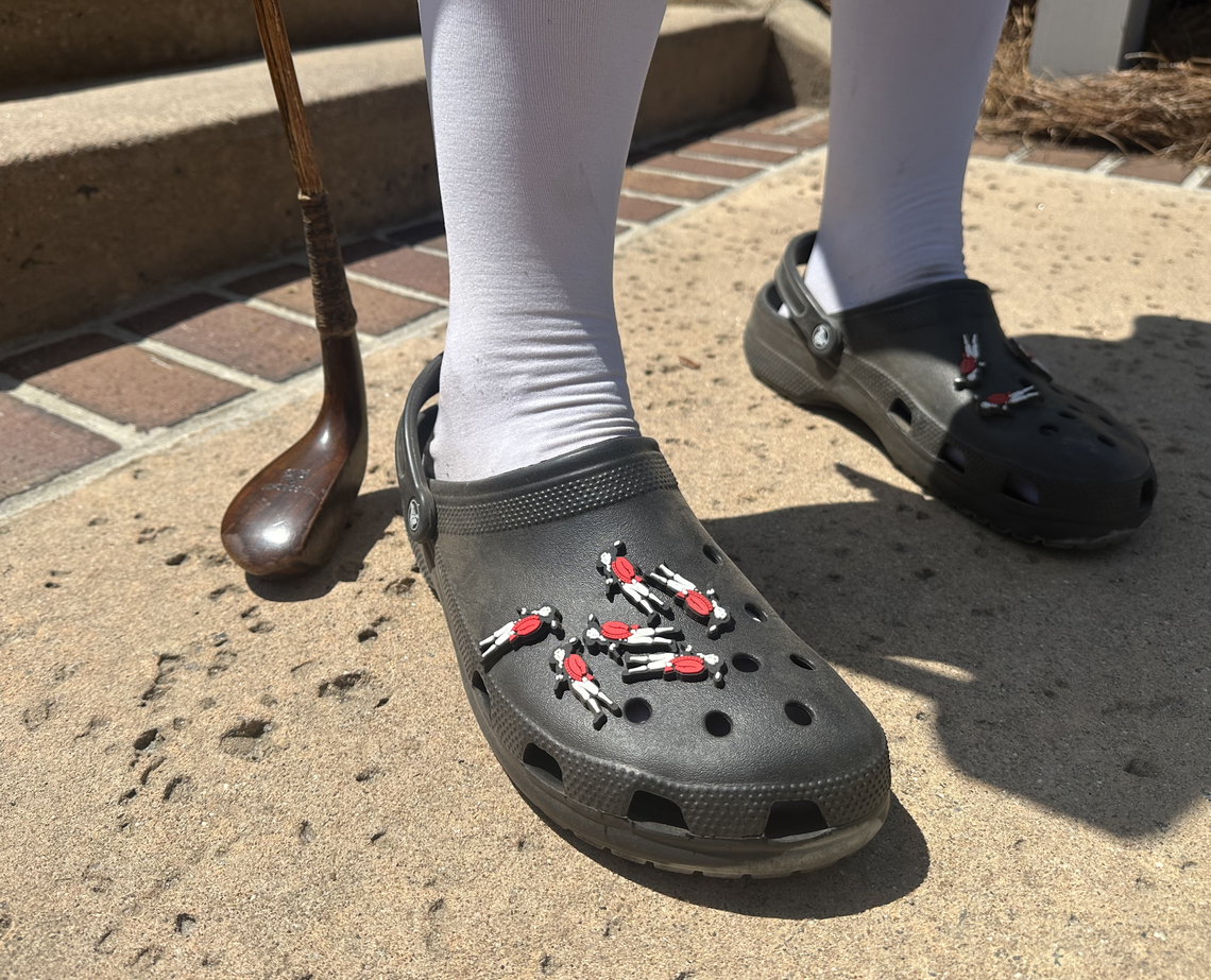 Tournament mascot Sir William Innes shows off newly designed Croc Jibbitz with the Heritage Classic Foudation’s logo, which can’t yet be purchased at the merchandise tent. “You’ll have to find me,” he says.