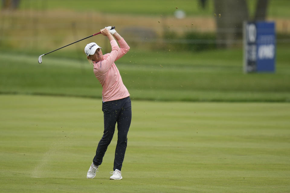 Stacy Lewis hits from the fairway on the 13th hole during the first round of the Women's PGA Championship golf tournament, Thursday, June 22, 2023, in Springfield, N.J. (AP Photo/Seth Wenig)