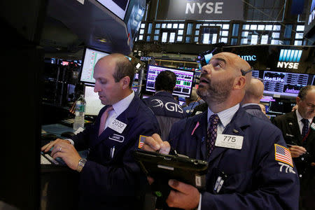 Traders work on the floor of the New York Stock Exchange (NYSE) in New York City, U.S., July 28, 2016. REUTERS/Brendan McDermid