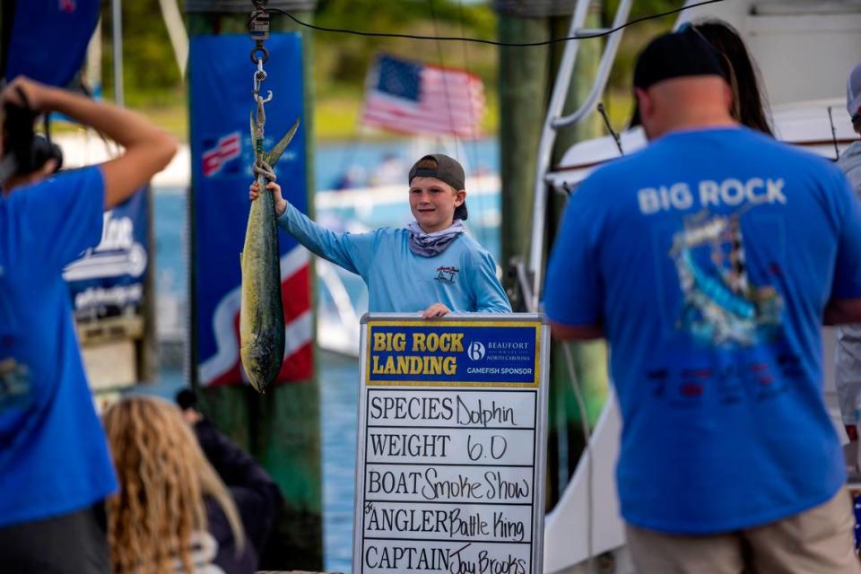 Battle King poses with a 6-pound dolphin fish during a weigh-in on Wednesday, June 12, 2024 at Big Rock Landing in Morehead City during the 66th Annual Big Rock Blue Marlin Tournament.