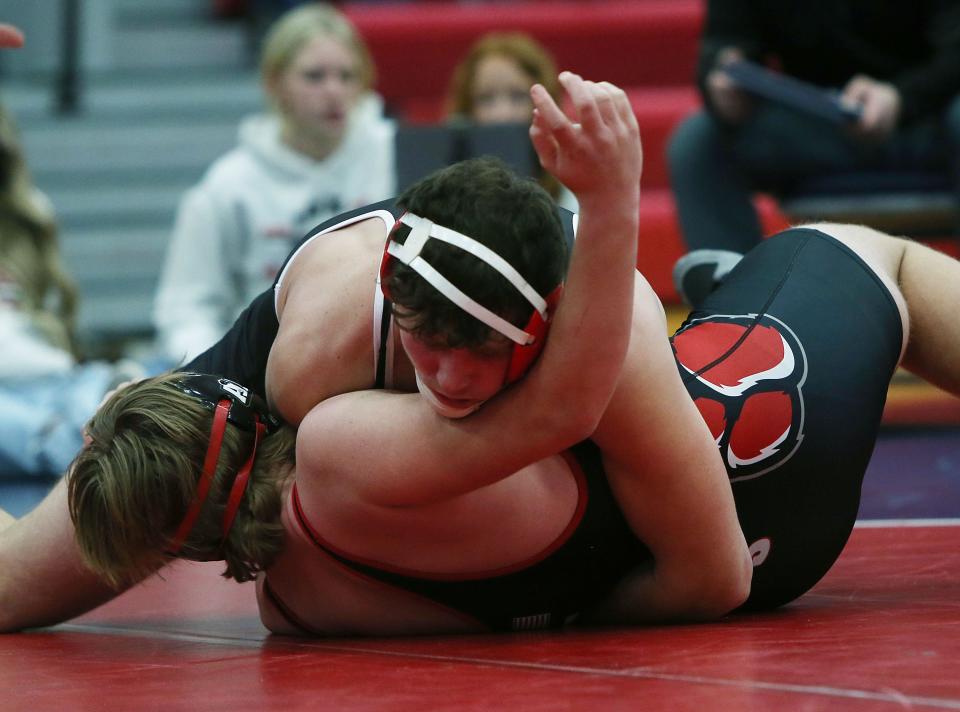 Ballard's Gabe Christensen, seen here pinning Adel-Desoto-Minburn's Drew Holman during a double-dual at Huxley Jan. 26, was one of two Bombers to claim a conference championship at the Raccoon River Conference meet Saturday at Gilbert. Christensen placed first at 195 pounds and Brody Sampson gave the Bombers a title at 182.