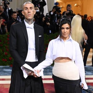 Kourtney Kardashian's Satin Pajama Shirt and Mom Jeans Look for Less - The  Budget Babe