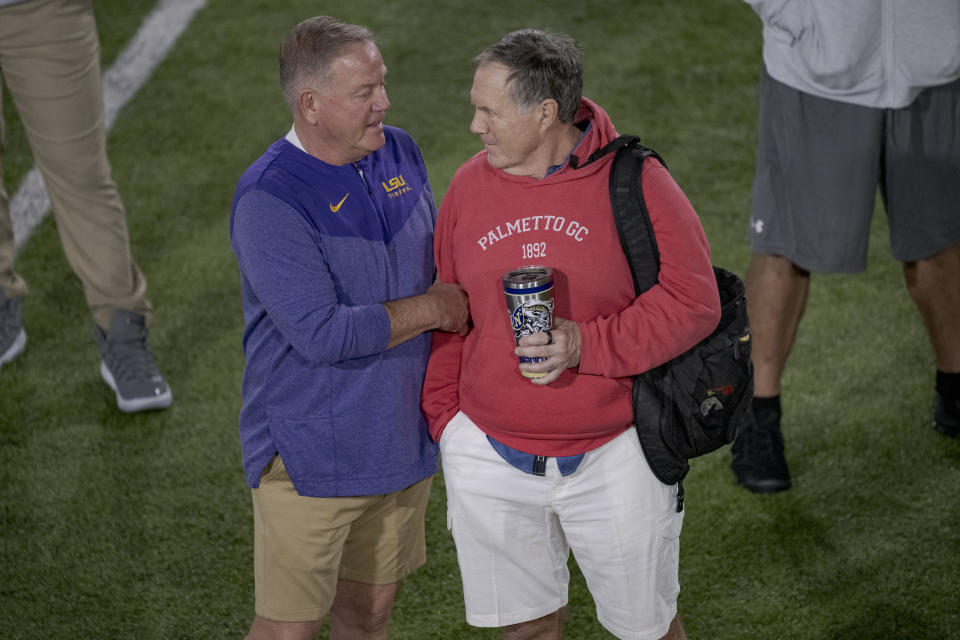 LSU head coach Brian Kelly talks with New England Patriots head coach Bill Belichick during LSU football Pro Day on Wednesday, March 29, 2023, in Baton Rouge, La. (AP Photo/Matthew Hinton)