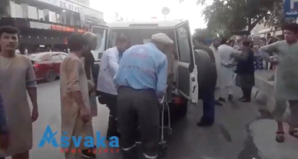 Injured people being helped out of an ambulance in Kabul. (Asvaka via Reuters)