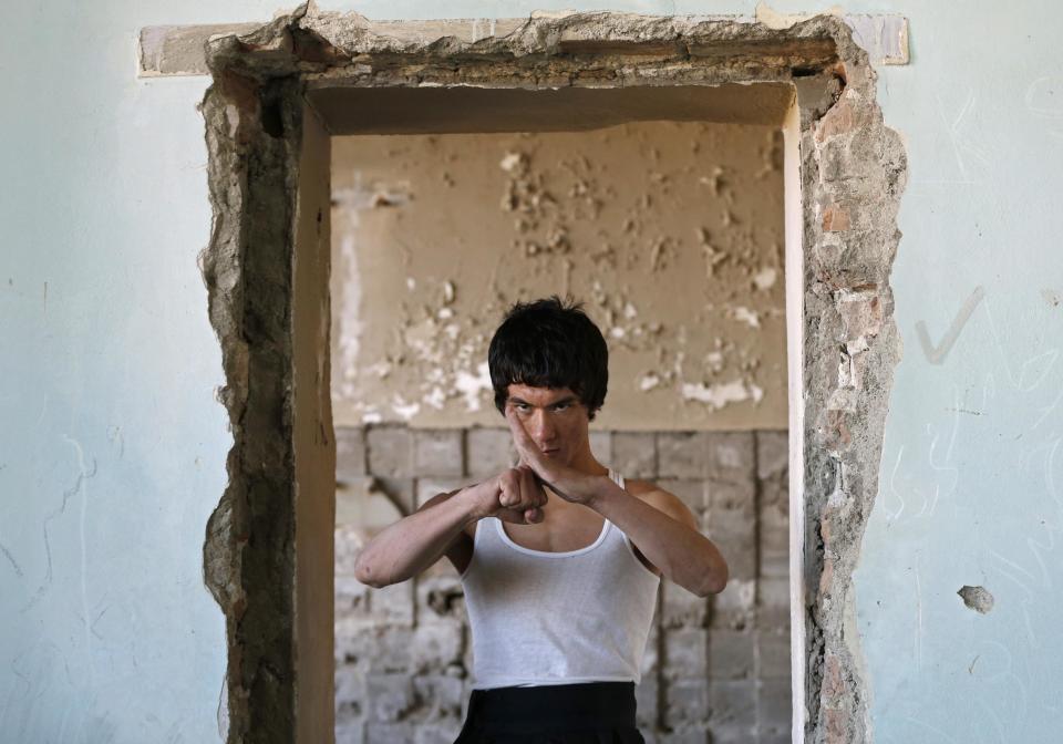 Abbas Alizada, who calls himself the Afghan Bruce Lee, poses during a media event in Kabul