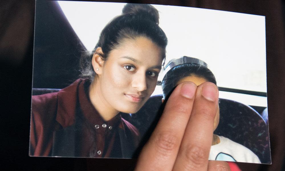 Renu Begum holds a photograph of her sister Shamima Begum