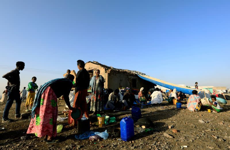 FILE PHOTO: Ethiopians who fled the ongoing fighting in Tigray region, gather in Hamdayet village near the Sudan-Ethiopia border, eastern Kassala state