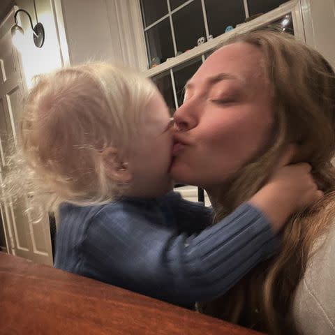 <p>Amanda Seyfried Instagram</p> Amanda Seyfried and her son Thomas kissing