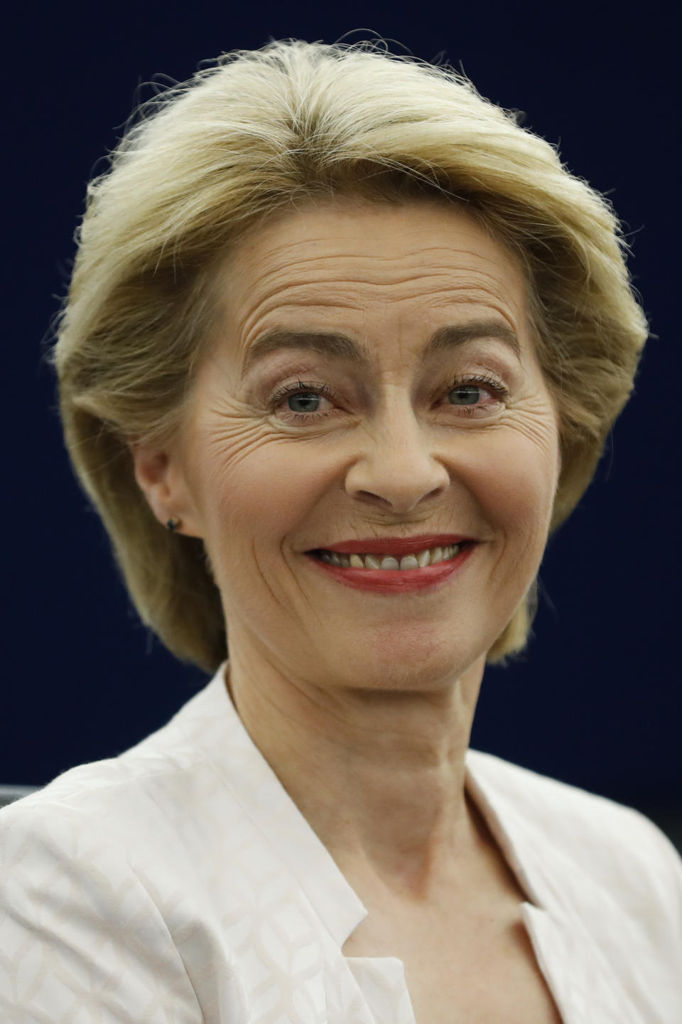 Ursula von der Leyen, the candidate to succeed Jean-Claude Juncker as head of the EU executive, smiles during a session at the European Parliament in Strasbourg, eastern France, Tuesday, July 16, 2019. (AP Photo/Jean-Francois Badias)