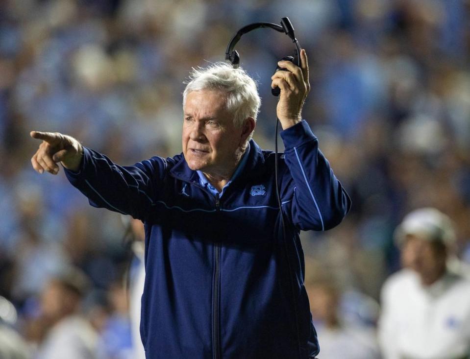 North Carolina coach Mack Brown checks the yardage on the Tar Heels second quarter touchdown drive against Miami on Saturday, October 14, 2023 at Kenan Stadium in Chapel Hill, N.C.