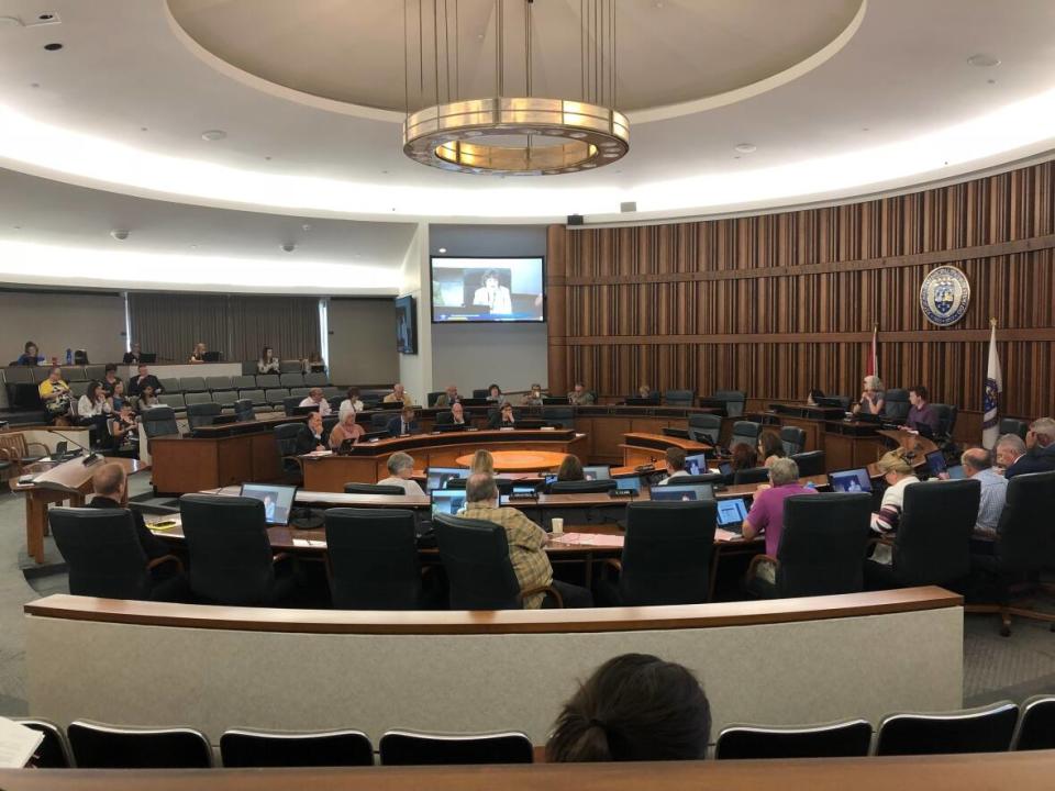 Councillors attend a committee meeting in the Region of Waterloo council chambers in August 2019. Regional council is made up of the regional chair, eight elected councillors, and the mayors of the three cities and four townships in the region. Six of the eight elected councillors aren't seeking re-election this fall.  (Kirthana Sasitharan/CBC - image credit)