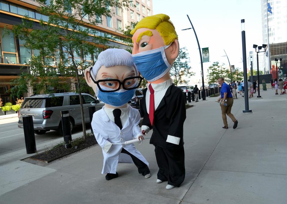 A costumed Donald Trump and Anthony Fauci before the Republican presidential debate in Milwaukee on Aug. 23, 2023.