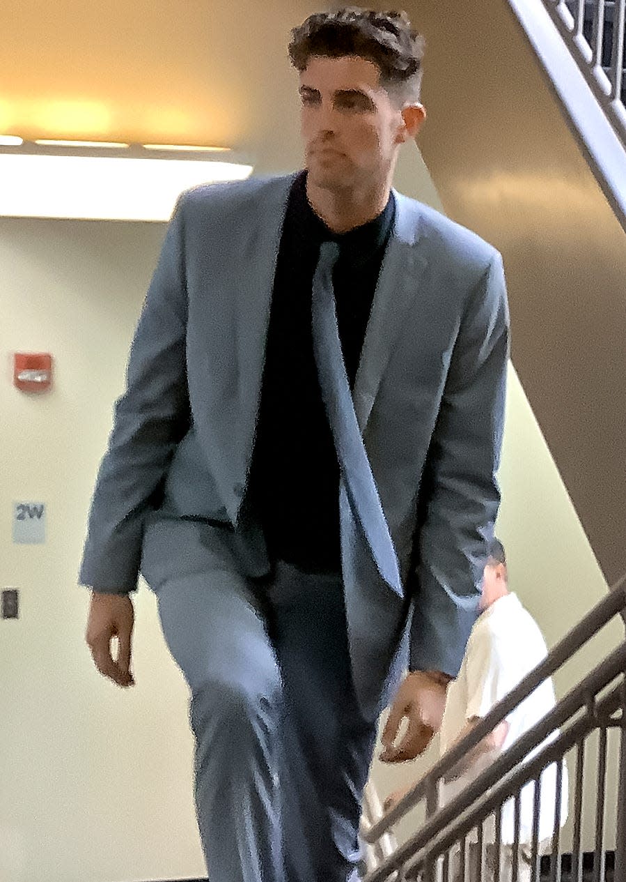 Gage Robert Ford walks up stairs at the Cleveland County Courthouse, with mother Nicole close behind, as he heads back to Judge Thad Balkman's courtroom to receive his verdict Friday. Ford was found guilty on one misdemeanor and two felony charges in a highly-publicized domestic abuse case.