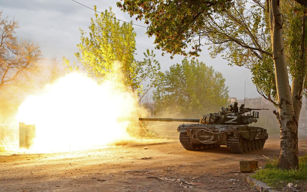 Service members of pro-Russian troops fire from a tank during fighting near the Azovstal steel plant in the southern port city of Mariupol - Alexander Ermochenko/Reuters