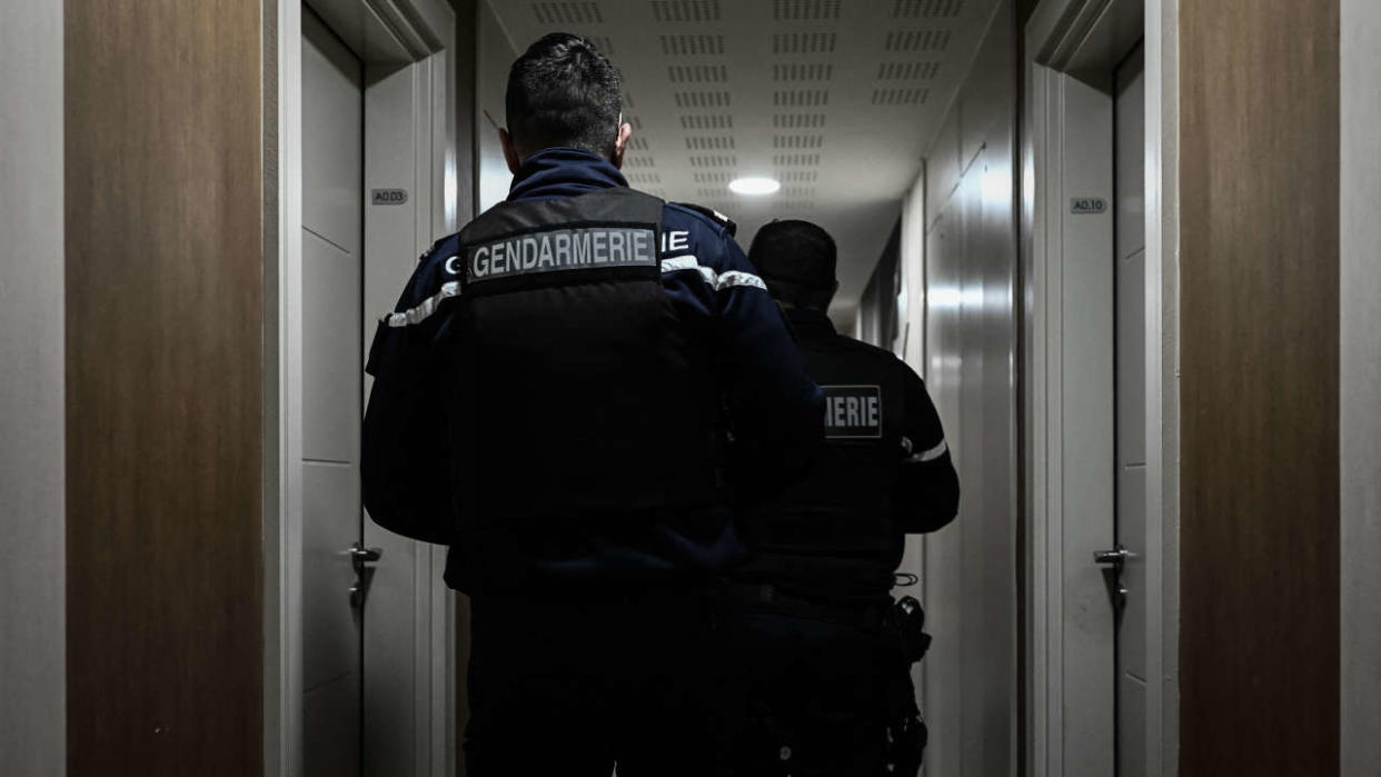 French gendarmes look for an address to deliver a judicial convocation in Carbon-Blanc, on the outskirts of Bordeaux, southwestern France, on March 2, 2021. - Refusal to comply, increasing insults, new delinquency, judicialisation... In the suburbs of Bordeaux, a suburban gendarmerie force looks for answers to a changing territory and population: no longer a rural police, but not an urban police force yet. (Photo by Philippe LOPEZ / AFP)