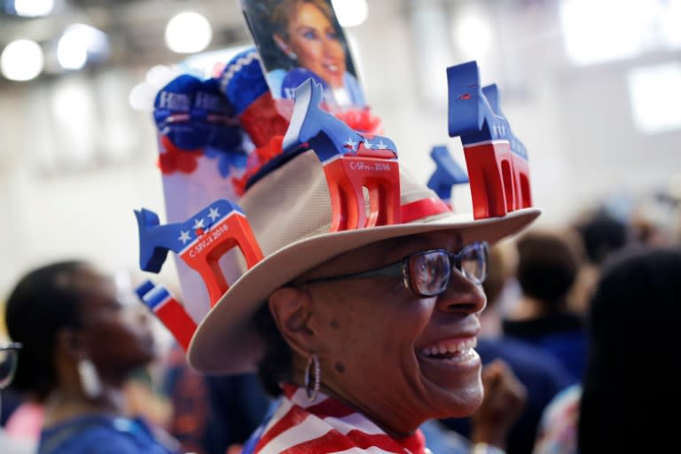 A supporter of Democratic presidential nominee Hillary Clinton wears a decorative hat at a voter registration rally in Philadelphia, Pennsylvania