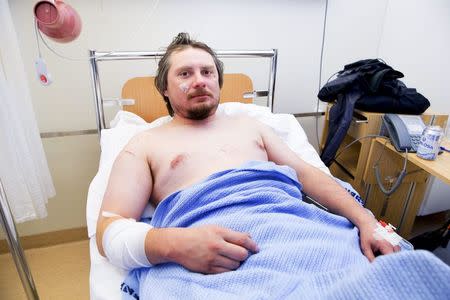 Jakub Moravec from Prague in the Czech Republic lies in his hospital bed at the Longyearbyen Hospital on Spitsbergen island, part of the Svalbard archipelago in the Arctic March 19, 2015. REUTERS/Hakon Mosvold Larsen/NTB Scanpix