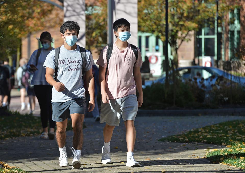 Gannon University then-freshmen Anthony Constantino, left, and Ryan Phan walk along A.J.'s Way on Nov. 9, 2020, at Gannon's downtown Erie campus.