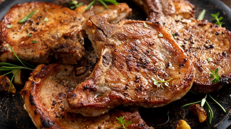 cooked pork chops with herbs