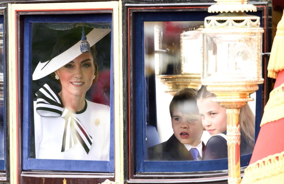 LONDON, ENGLAND - JUNE 15: Catherine, Princess of Wales, Prince Louis and Princess Charlotte during Trooping the Colour on June 15, 2024 in London, England. Trooping the Colour is a ceremonial parade celebrating the official birthday of the British Monarch. The event features over 1,400 soldiers and officers, accompanied by 200 horses. More than 400 musicians from ten different bands and Corps of Drums march and perform in perfect harmony. (Photo by Karwai Tang/WireImage)