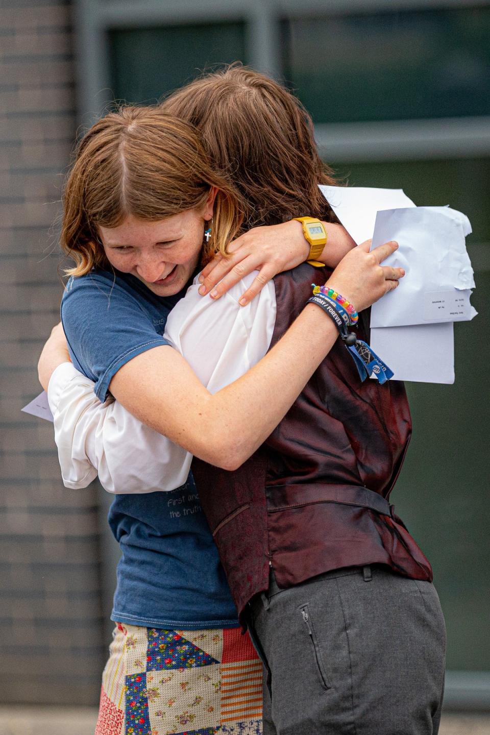 (from left) Grace Ford and Miriam McGrath hug as they open their GCSE results (Ben Birchall/PA) (PA Wire)