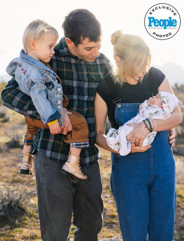 <p>National Geographic/Eliza Earle</p> Alex Honnold holds daughter June as Sanni Honnold holds daughter Alice