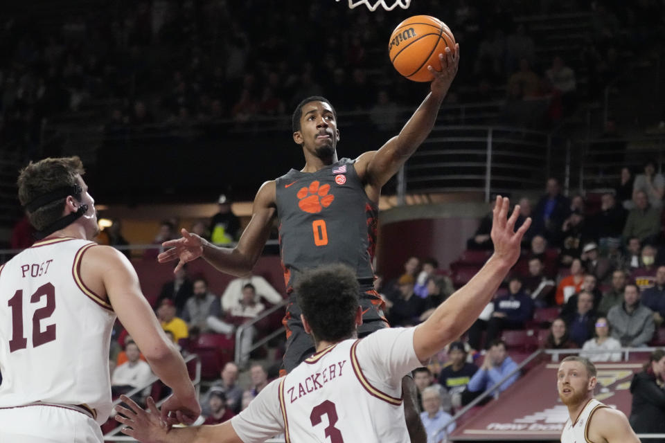 Clemson guard Joshua Beadle (0) drives to the basket against Boston College during the first half of an NCAA college basketball game, Tuesday, Jan. 31, 2023, in Boston. (AP Photo/Charles Krupa)