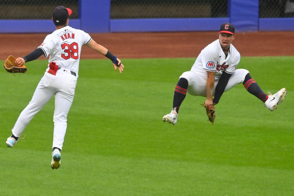 Guardians left fielder Steven Kwan (38) and right fielder Will Brennan celebrate after defeating the Toronto Blue Jays on June 22 in Cleveland.