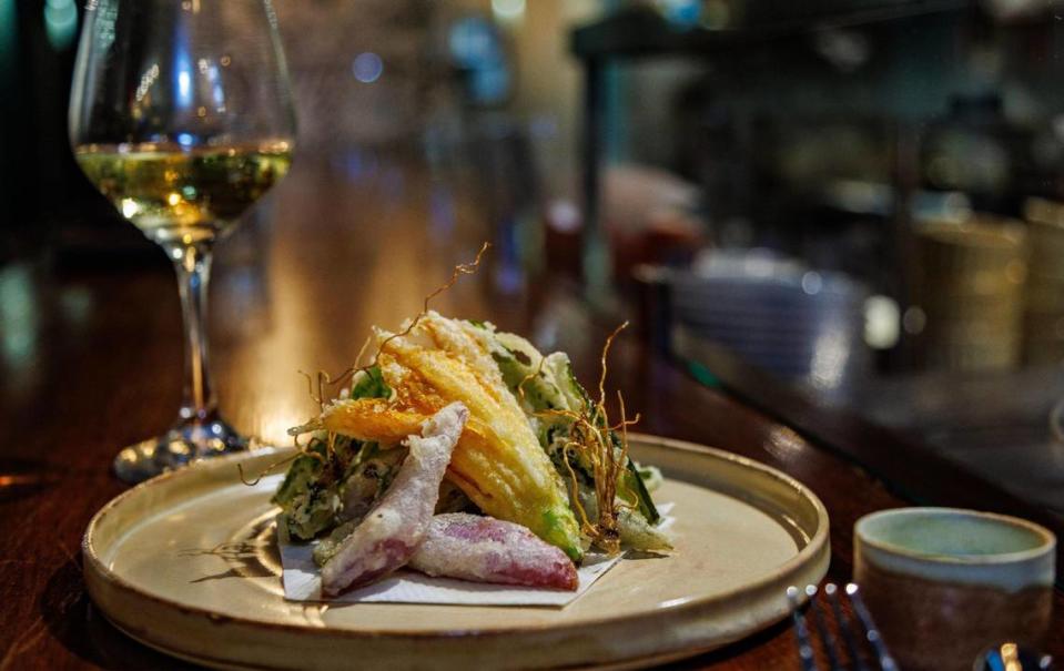 A tempura-fried crispy salad at EntreNos features squash blossom, okra and daikon radish at the new restaurant inside Tinta Y Cafe in Miami Shores.