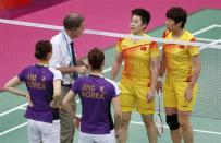 The World Badminton Federation charged eight female players with misconduct on August 1, 2012 after four Olympic doubles teams had attempted to "throw" matches to secure a more favorable draw later in the tournament. Tournament referee Torsten Berg (2nd L) speaks to players from China and South Korea during their women's doubles group play stage Group A badminton match during the London 2012 Olympic Games at the Wembley Arena July 31, 2012.