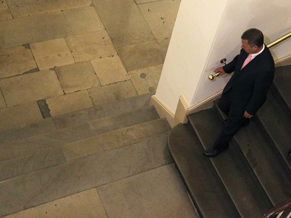 U.S. Speaker of the House John Boehner leaves the U.S. Capitol building after 1:00 a.m. in the morning after the House of Representatives voted to send their funding bill with delays to the "Obamacare" health care act into a conference with the Senate, prompting a shutdown of portions of the U.S. government in Washington October 1, 2013. The U.S. government began a partial shutdown on Tuesday for the first time in 17 years, potentially putting up to 1 million workers on unpaid leave, closing national parks and stalling medical research projects. REUTERS/Jim Bourg (UNITED STATES - Tags: POLITICS BUSINESS)