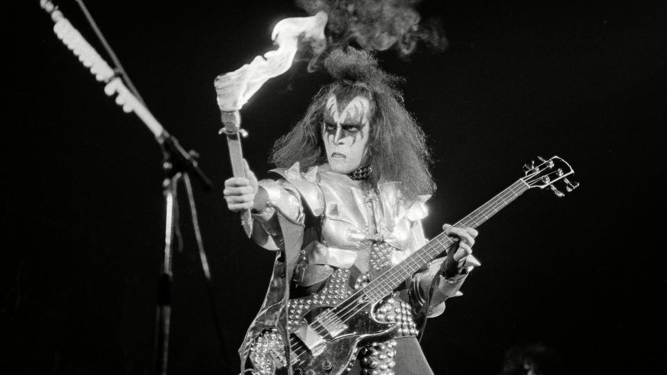 Gene Simmons, bass guitarist for Kiss, gets ready to breathe fire during the crescendo of "Firehouse," a number performed during a concert in Hartford