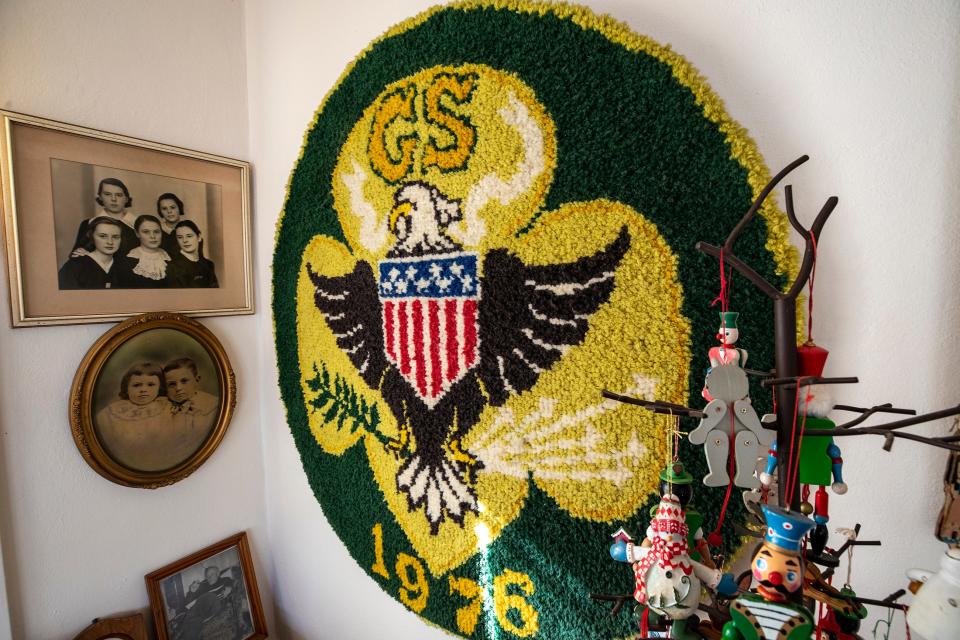 A display in the home of Lenore "Gundy" Costello recognizes her 25 years as director of the local chapter of the Girl Scouts. Costello, who turns 107 on Sunday, was honored as the oldest Girl Scout in the country at the Girl Scouts' national conference in July.