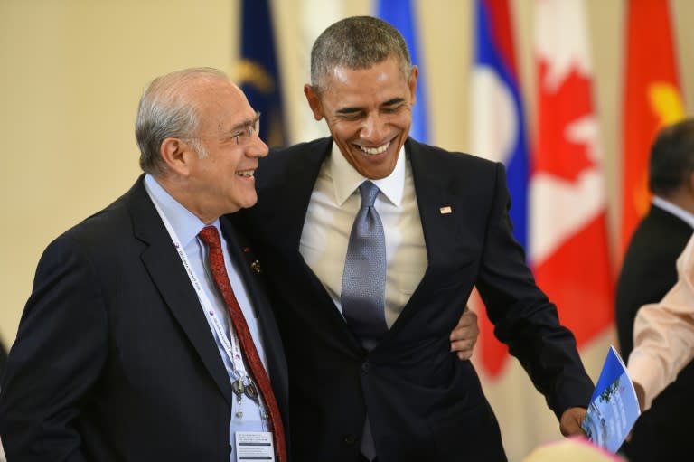 US President Barack Obama (right) speaks with OECD Secretary-General Angel Gurria at the G7 summit in Japan on May 27, 2016